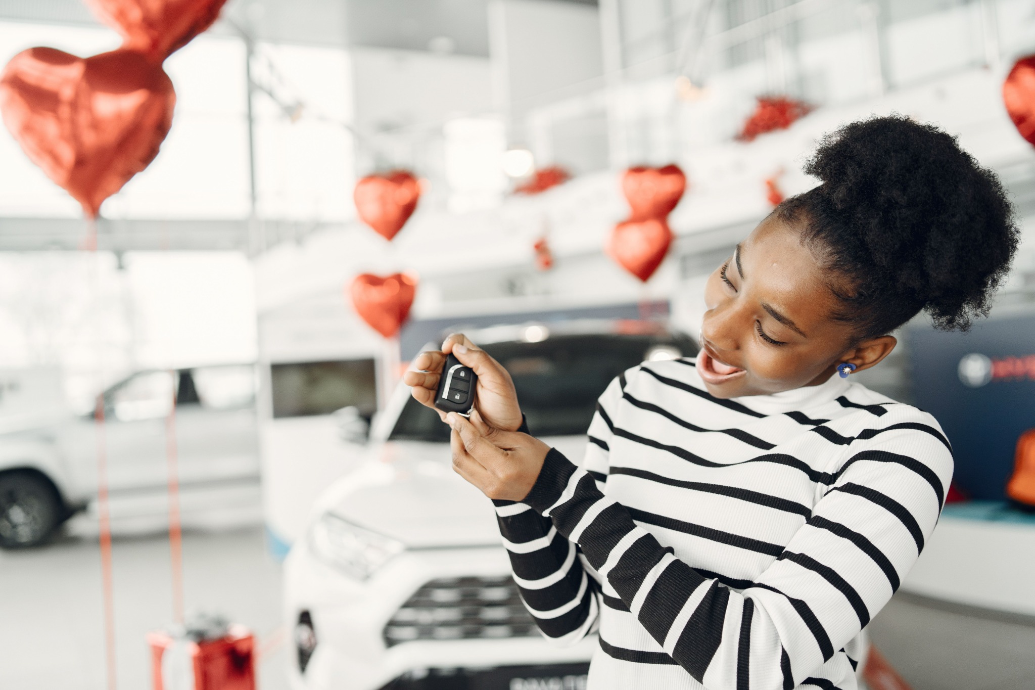 Customer receiving keys for a new vehicle