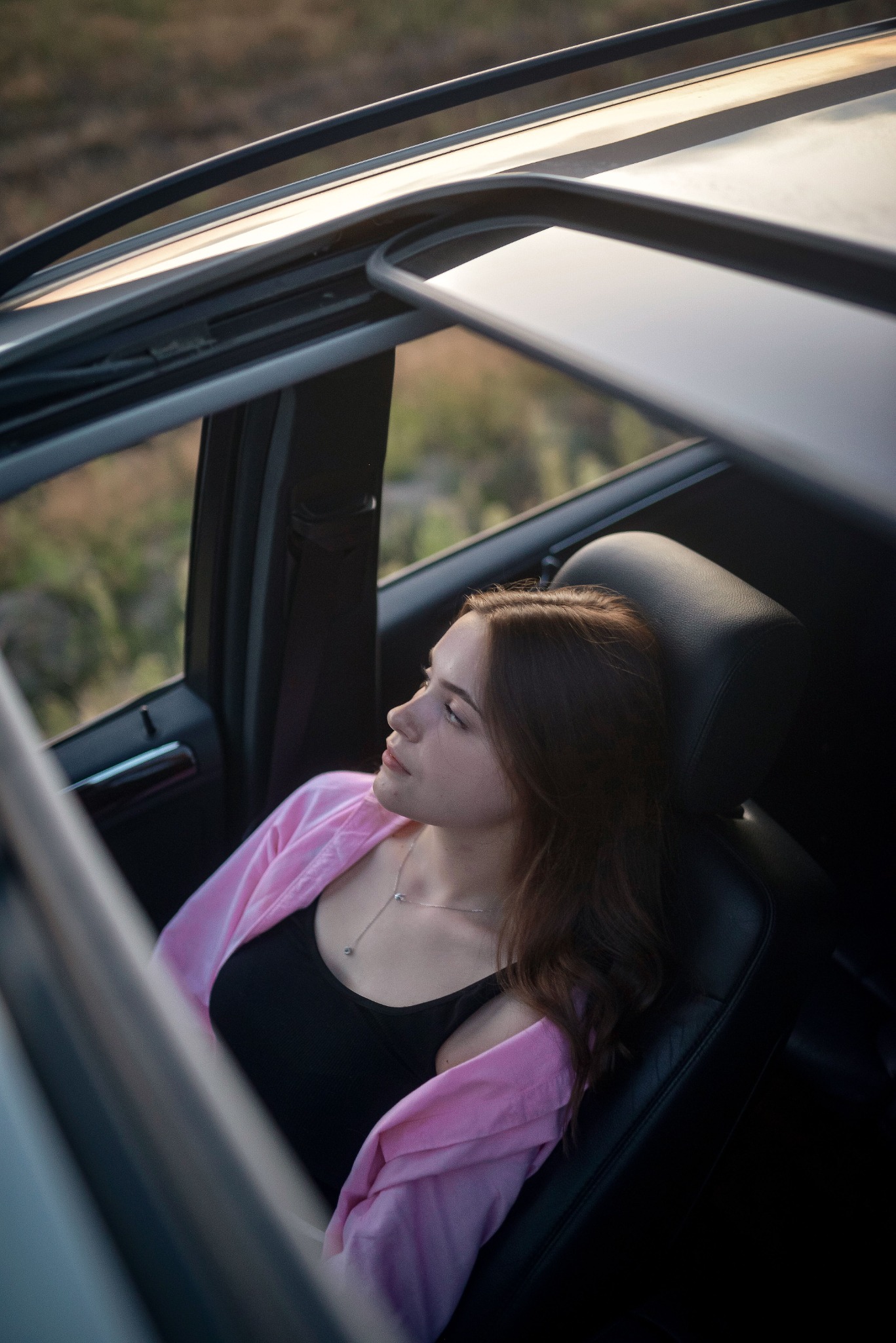 Relaxed driver enjoying her vehicle